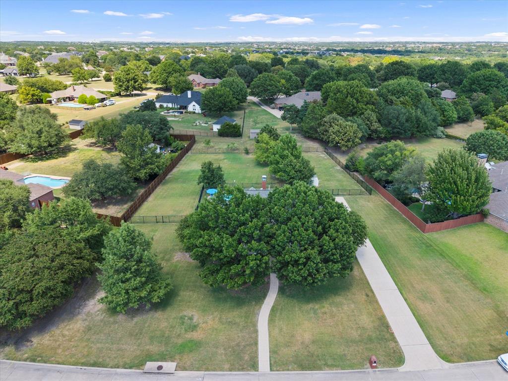425 Chippendale Drive Heath, TX 75032 - Photo 35 of 37 a view of a lush green forest with houses