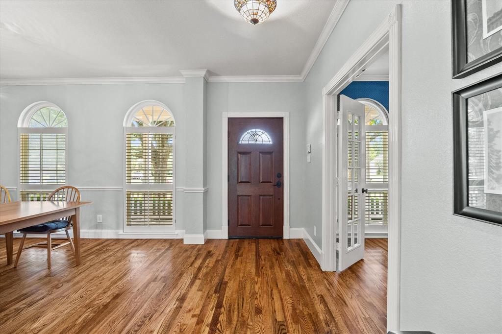 425 Chippendale Drive Heath, TX 75032 - Photo 6 of 37 a view of empty room with wooden floor and fan