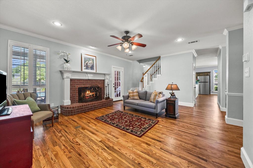 425 Chippendale Drive Heath, TX 75032 - Photo 7 of 37 a living room with furniture and a fireplace
