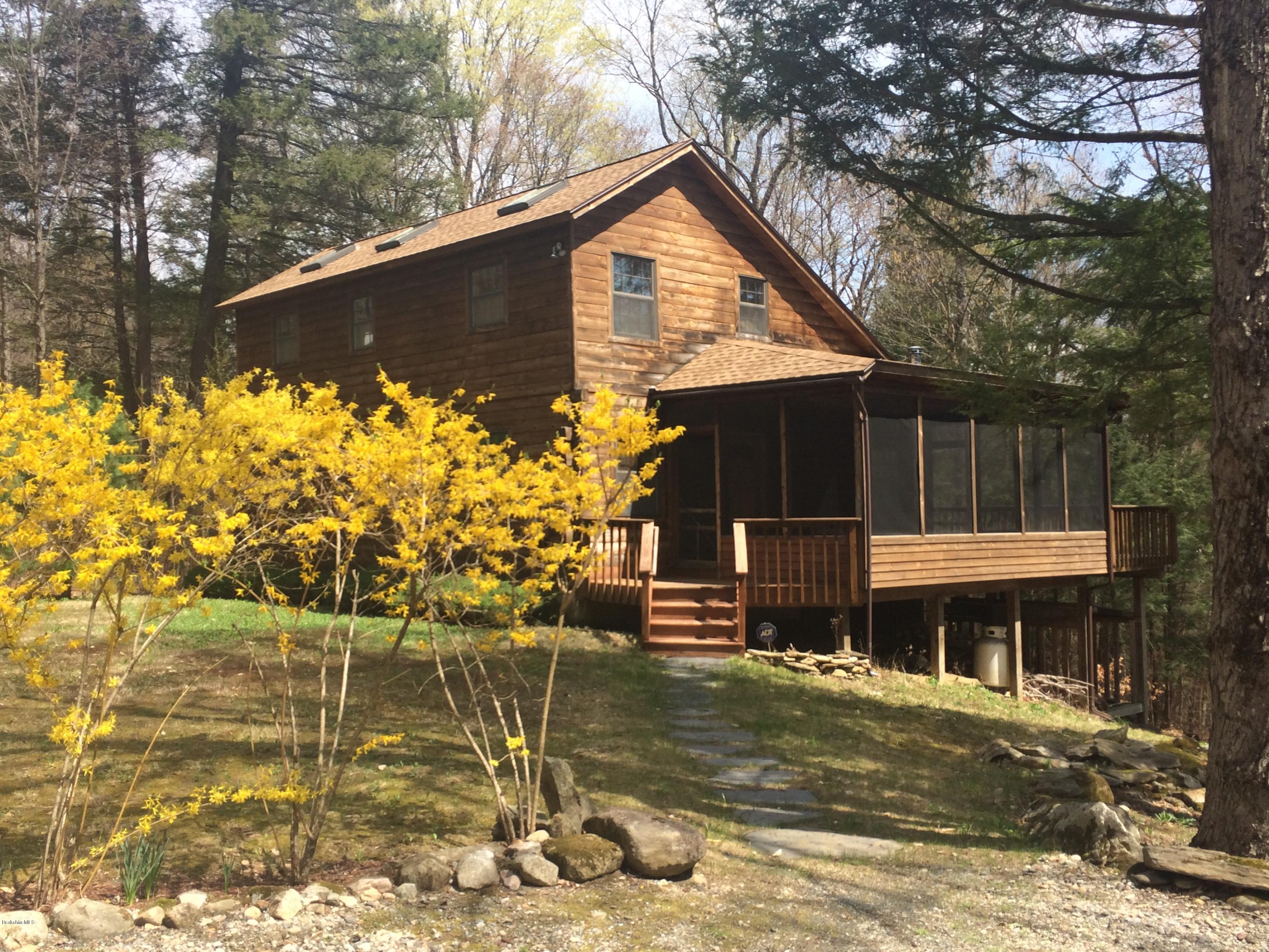 857 Surriner Road Becket, MA 01223 - Photo 1 of 27 a front view of a house