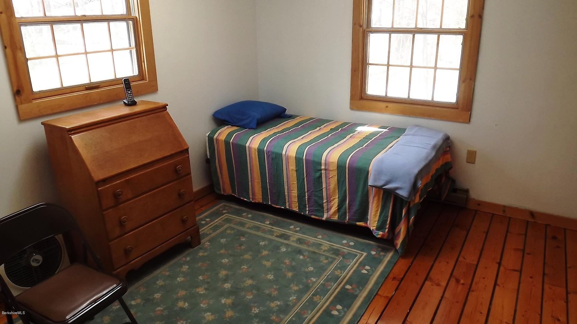 857 Surriner Road Becket, MA 01223 - Photo 22 of 27 a bedroom with two beds and a window