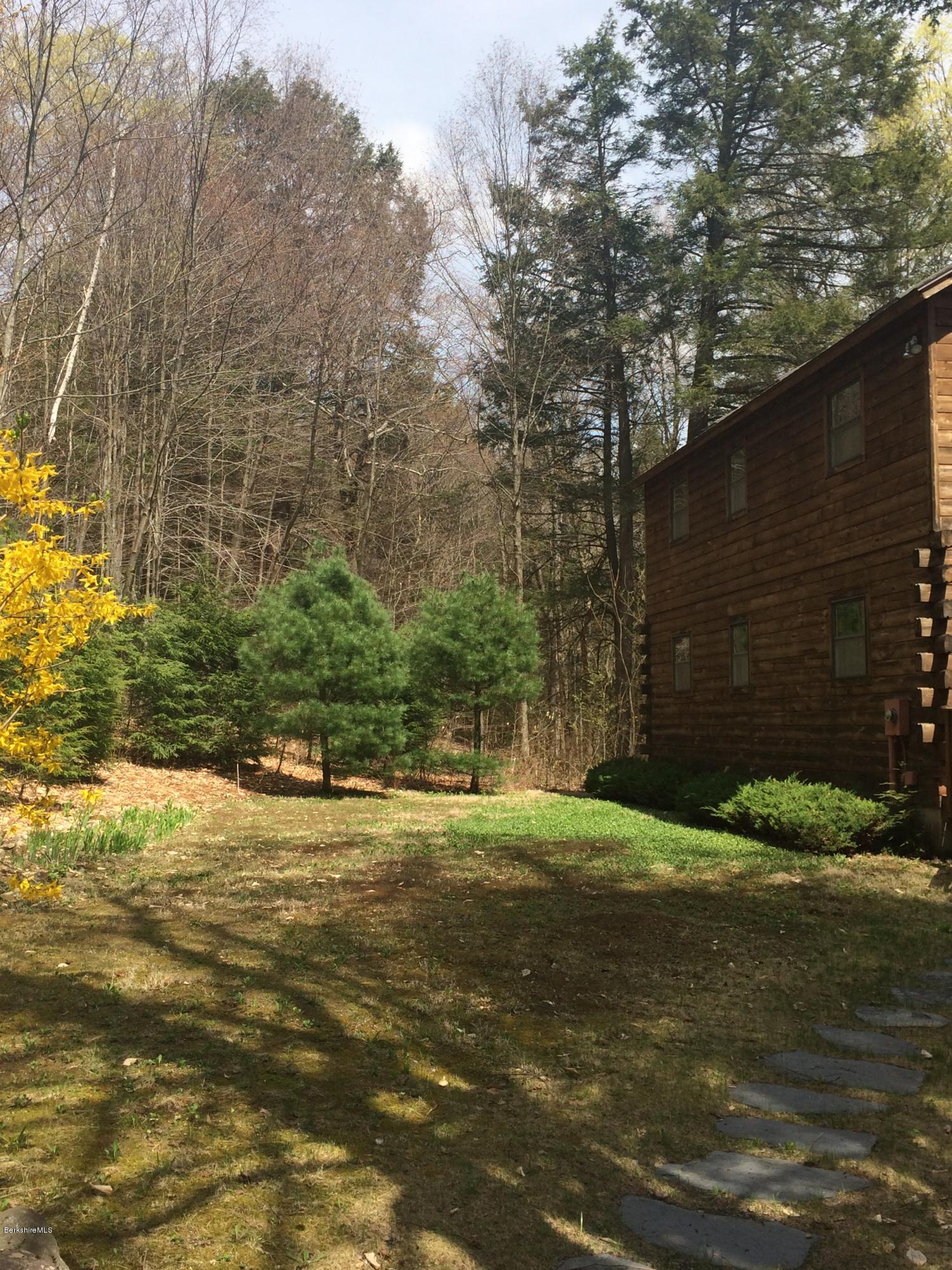 857 Surriner Road Becket, MA 01223 - Photo 5 of 27 a backyard of a house with lots of green space
