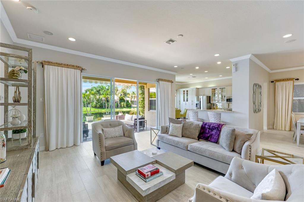 6582 Monterey Point Naples, FL 34105 - Photo 5 of 27 a living room with furniture and a large window