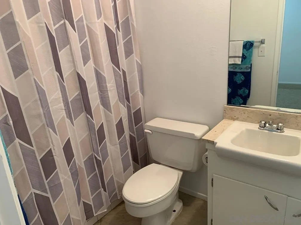 28757 West Worcester Road Menifee, CA 92586 - Photo 15 of 21 a white toilet sitting next to a bathroom sink