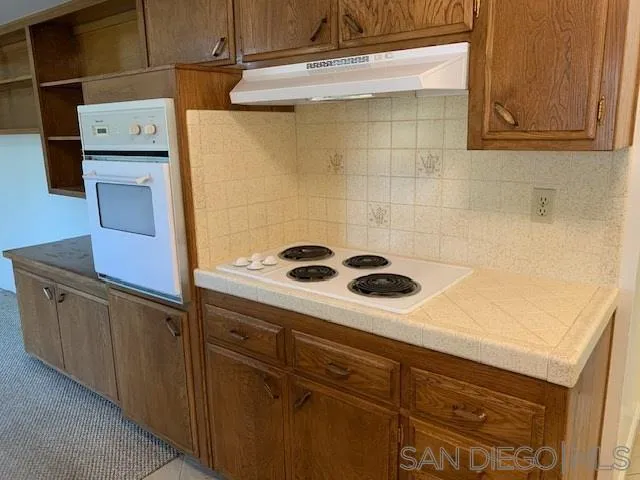 28757 West Worcester Road Menifee, CA 92586 - Photo 10 of 21 a kitchen with a refrigerator and cabinets