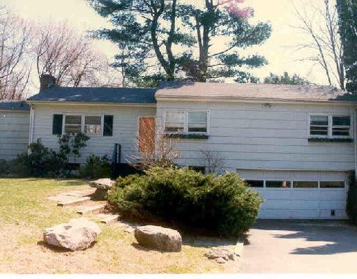 52 Drumlin Road Westport, CT 06880 - Photo 1 of 1 a view of a house with a yard covered in snow