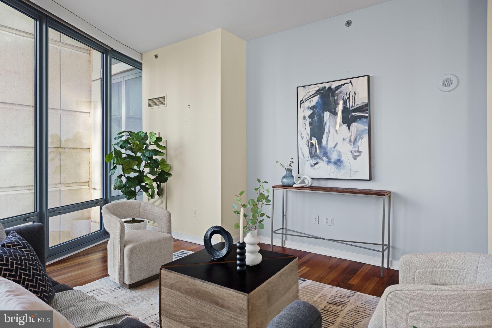 2101 Market Street, Unit 302 Philadelphia, PA 19103 - Photo 20 of 53 a living room with furniture and a potted plant