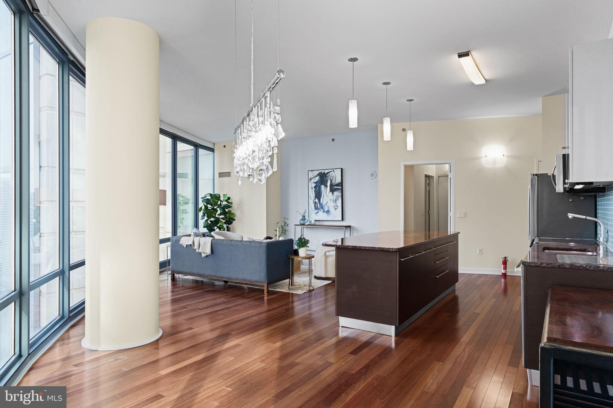 2101 Market Street, Unit 302 Philadelphia, PA 19103 - Photo 22 of 53 a living room with furniture and a wooden floor