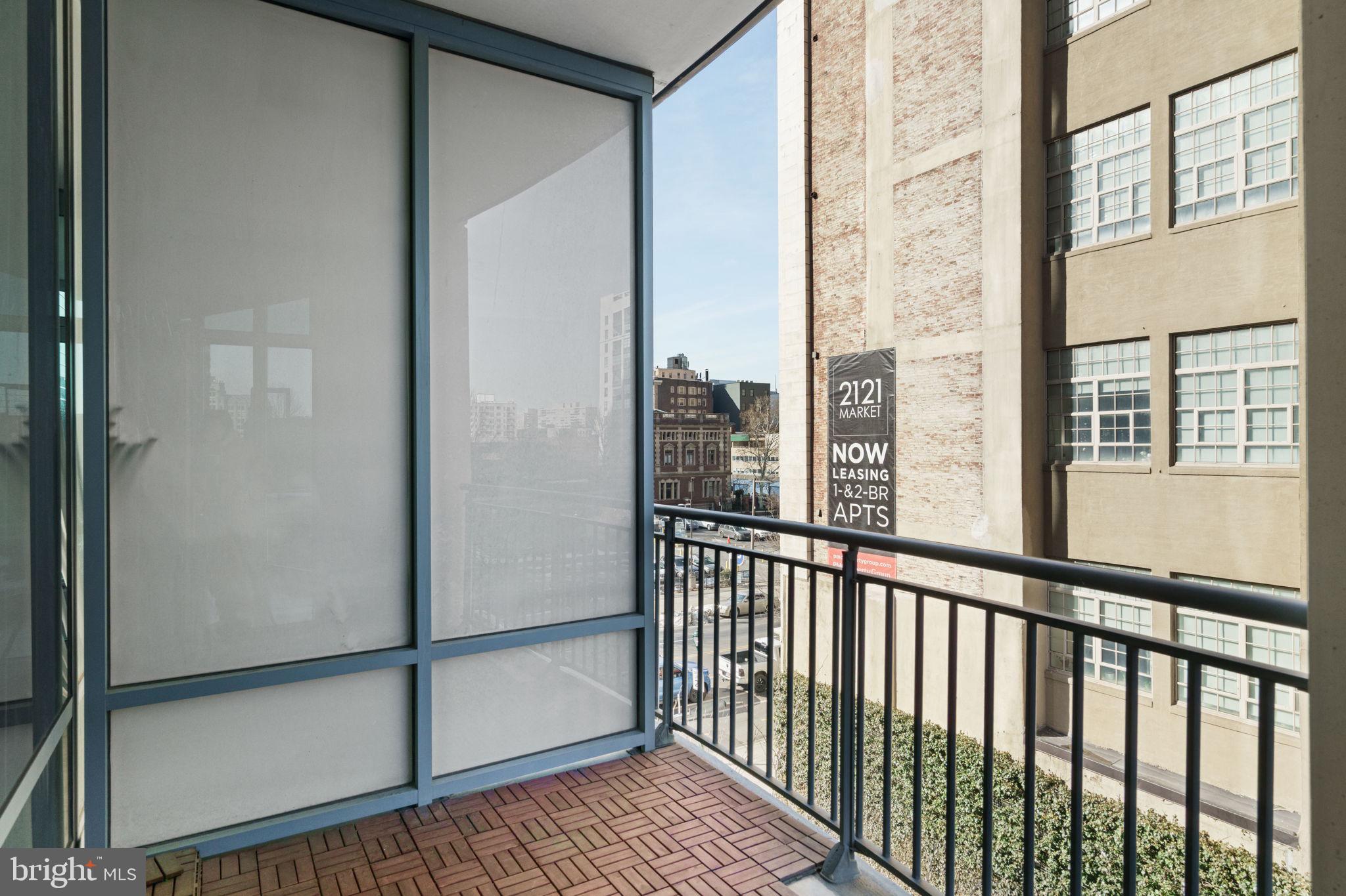 2101 Market Street, Unit 302 Philadelphia, PA 19103 - Photo 24 of 53 a view of a balcony with wooden floor