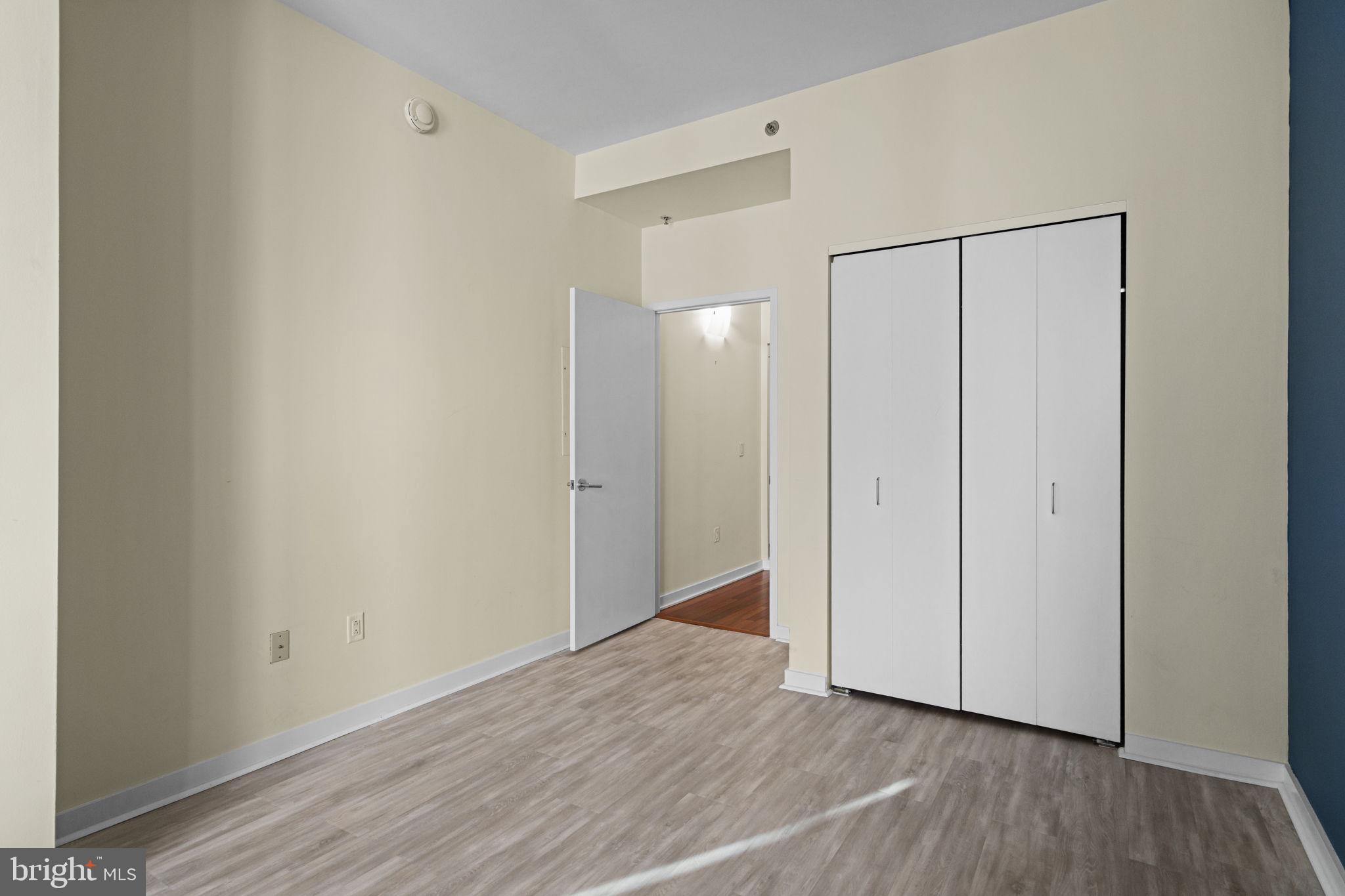 2101 Market Street, Unit 302 Philadelphia, PA 19103 - Photo 27 of 53 a view of an empty room with wooden floor