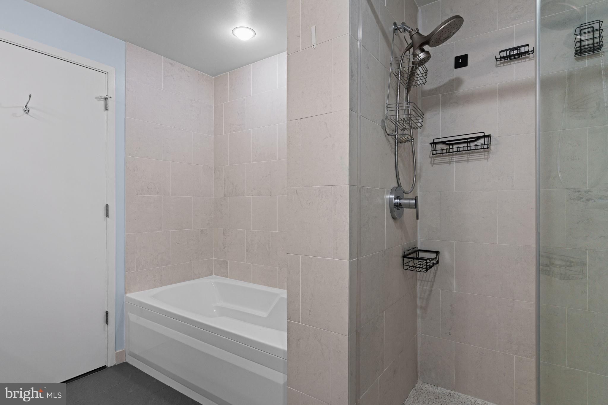 2101 Market Street, Unit 302 Philadelphia, PA 19103 - Photo 31 of 53 a bathroom with a shower