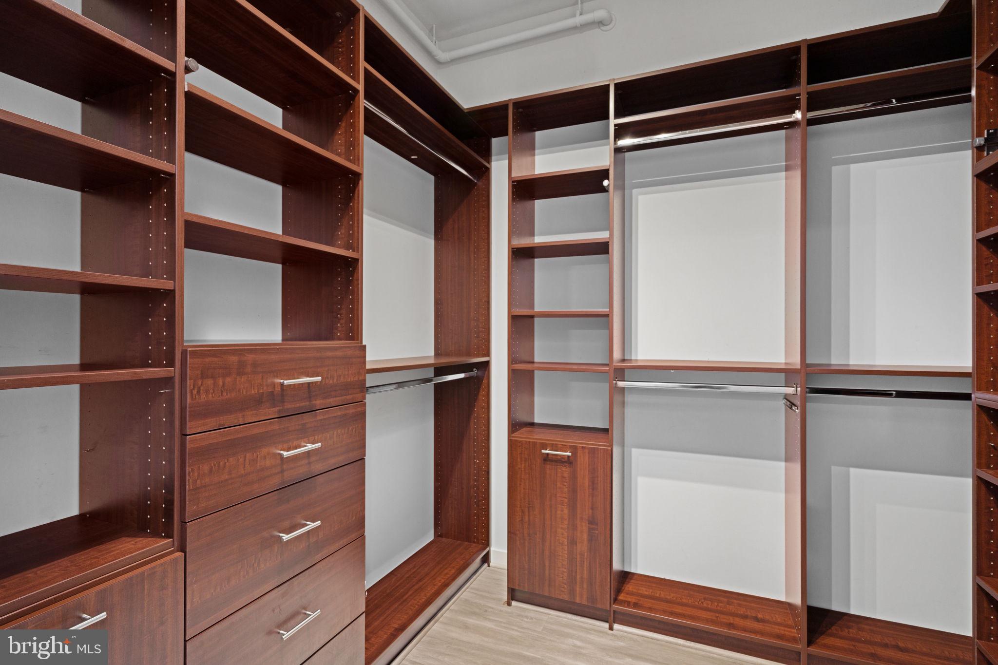 2101 Market Street, Unit 302 Philadelphia, PA 19103 - Photo 36 of 53 a view of walk in closet with empty racks