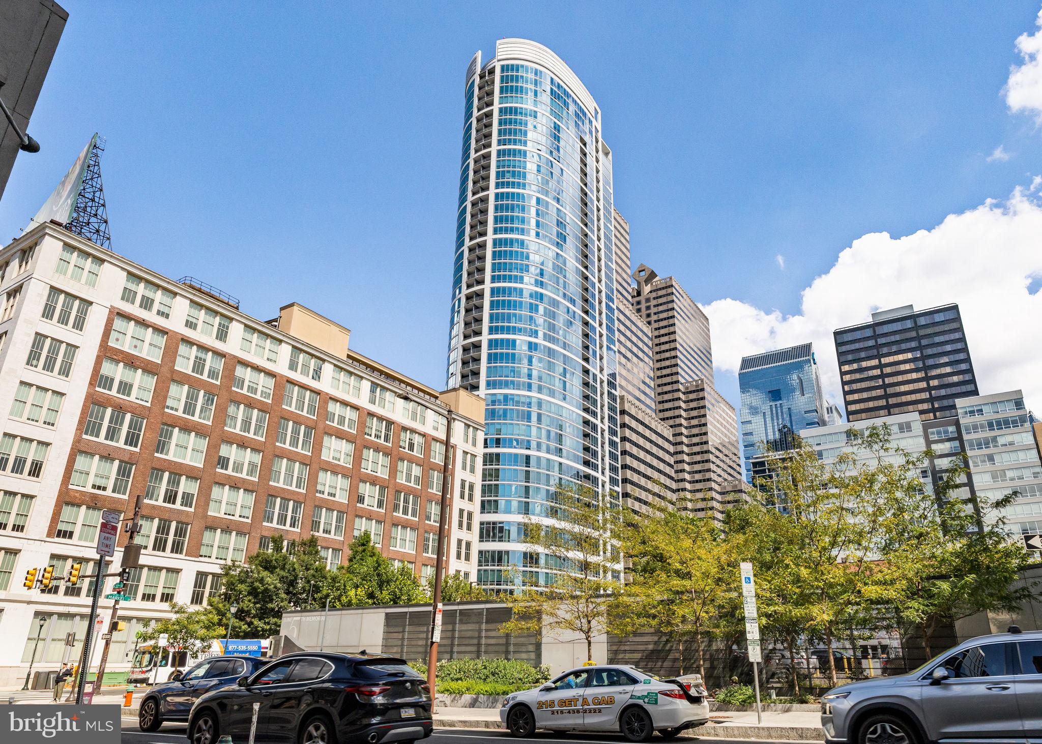 2101 Market Street, Unit 302 Philadelphia, PA 19103 - Photo 39 of 53 a view of a buildings and cars parked in front of it