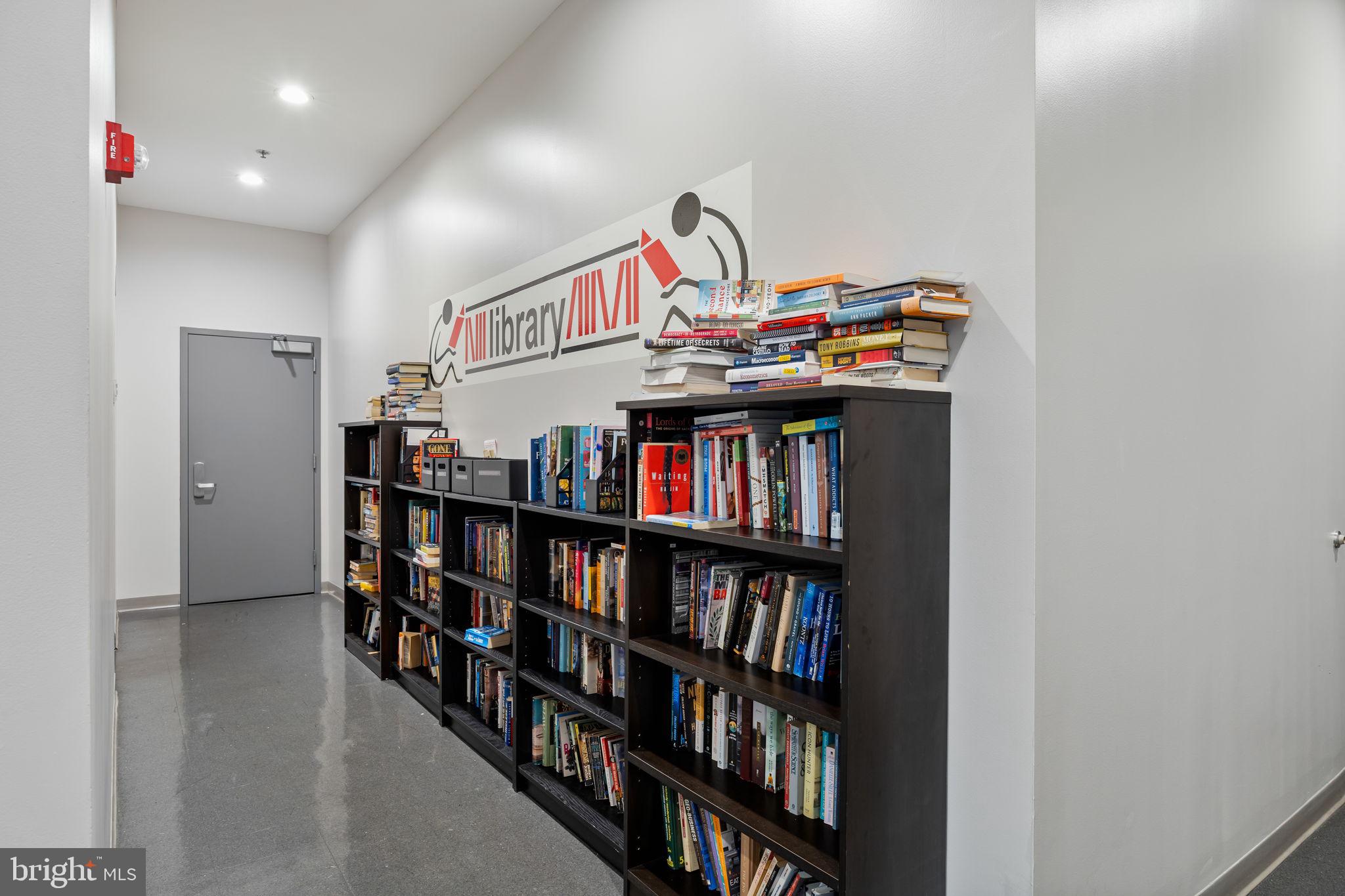 2101 Market Street, Unit 302 Philadelphia, PA 19103 - Photo 46 of 53 a living room with lots of books