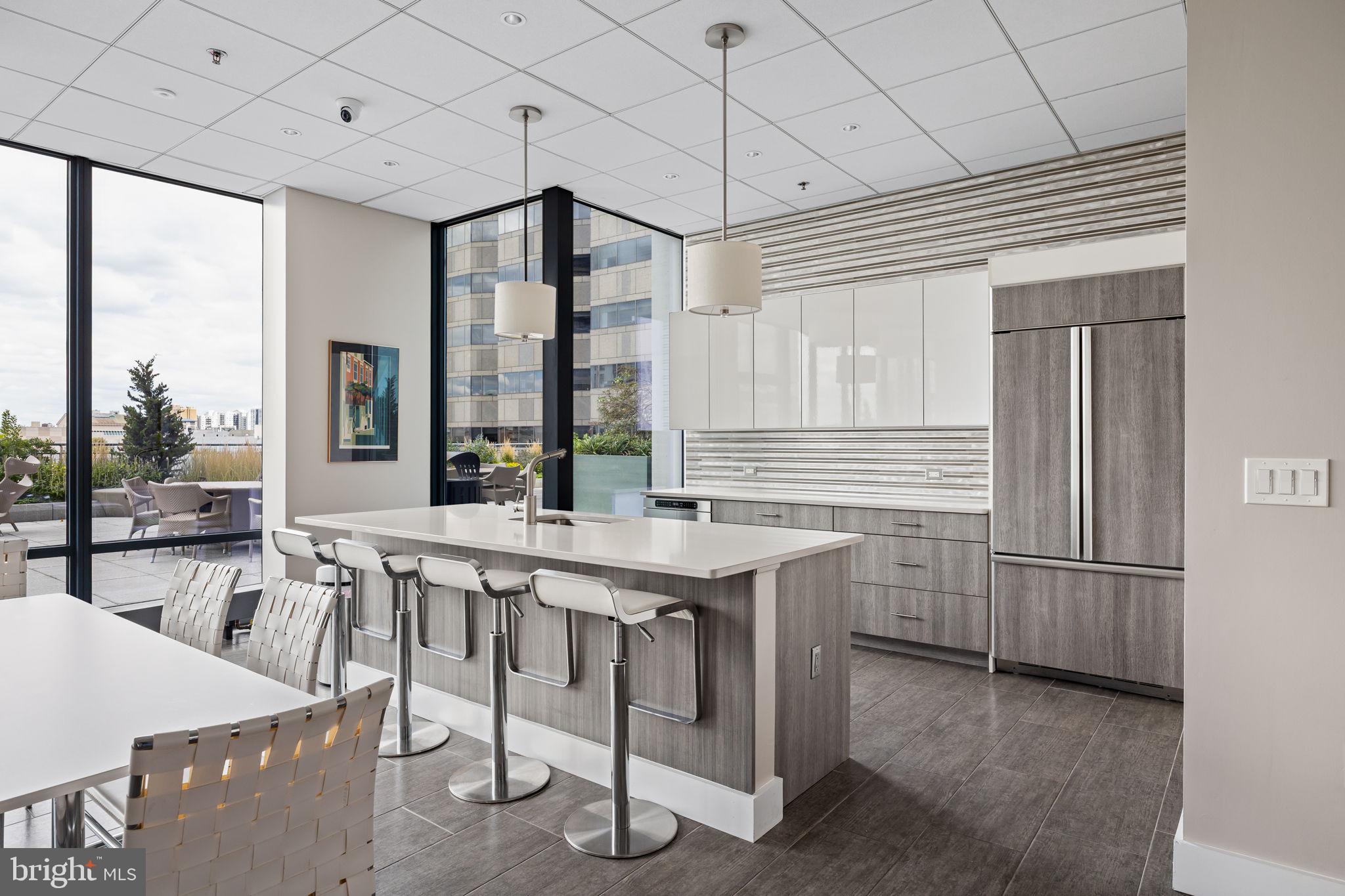 2101 Market Street, Unit 302 Philadelphia, PA 19103 - Photo 48 of 53 a kitchen with refrigerator and cabinets