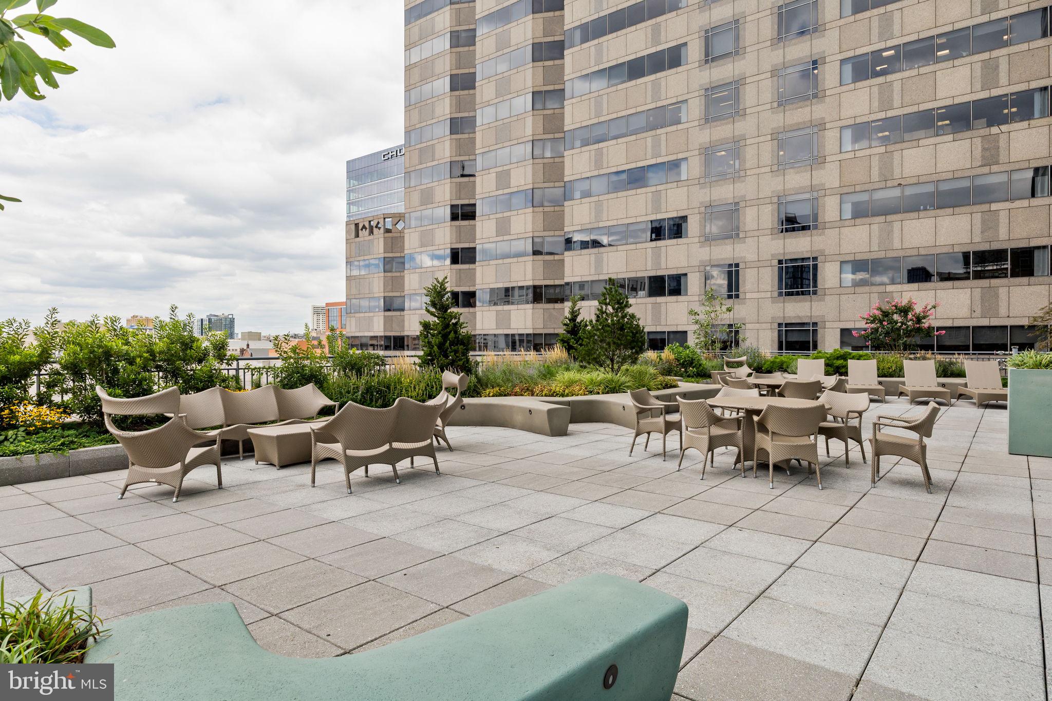 2101 Market Street, Unit 302 Philadelphia, PA 19103 - Photo 51 of 53 a view of a patio with dining table and chairs