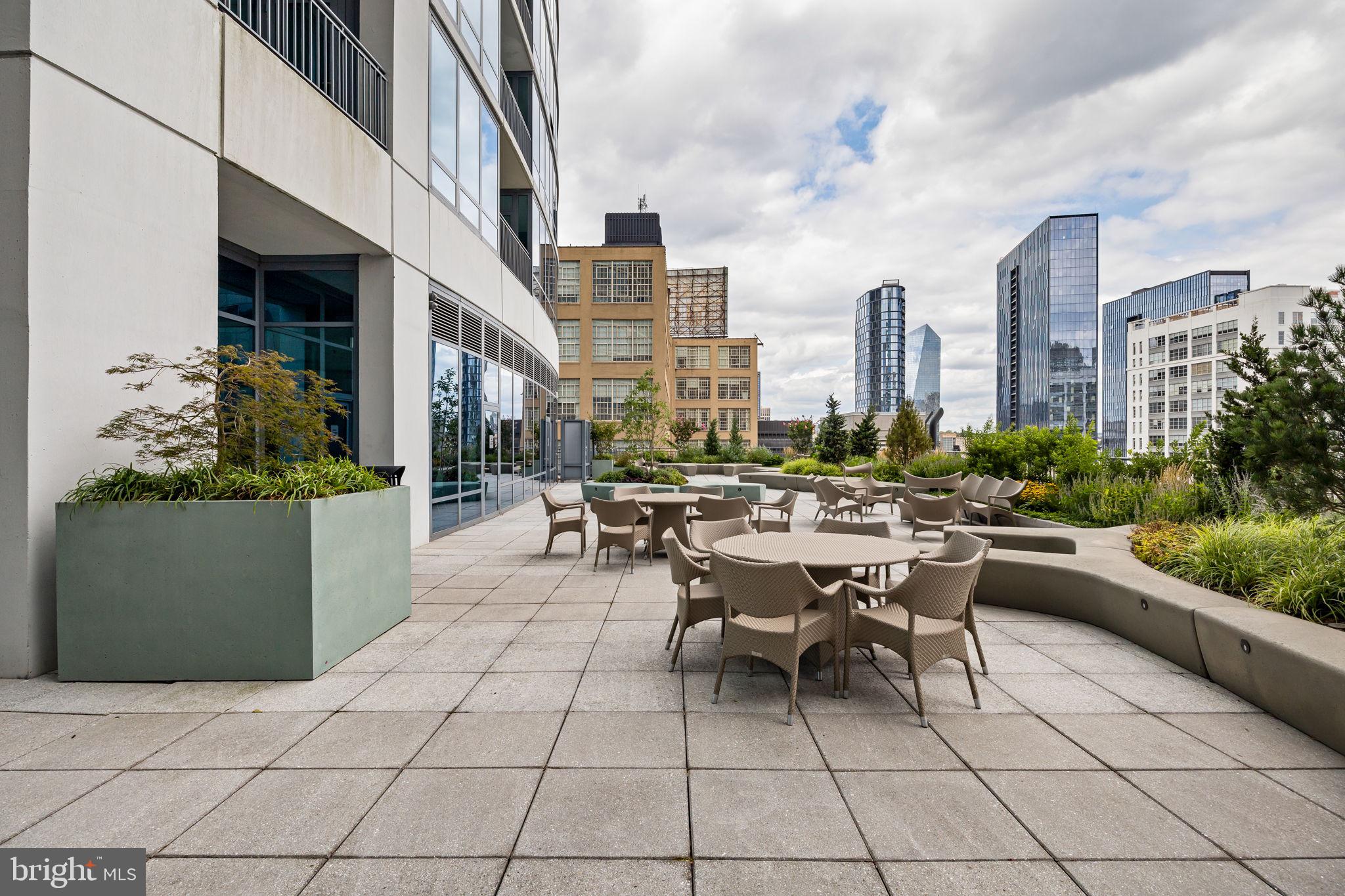 2101 Market Street, Unit 302 Philadelphia, PA 19103 - Photo 52 of 53 a view of a patio with dining table and chairs