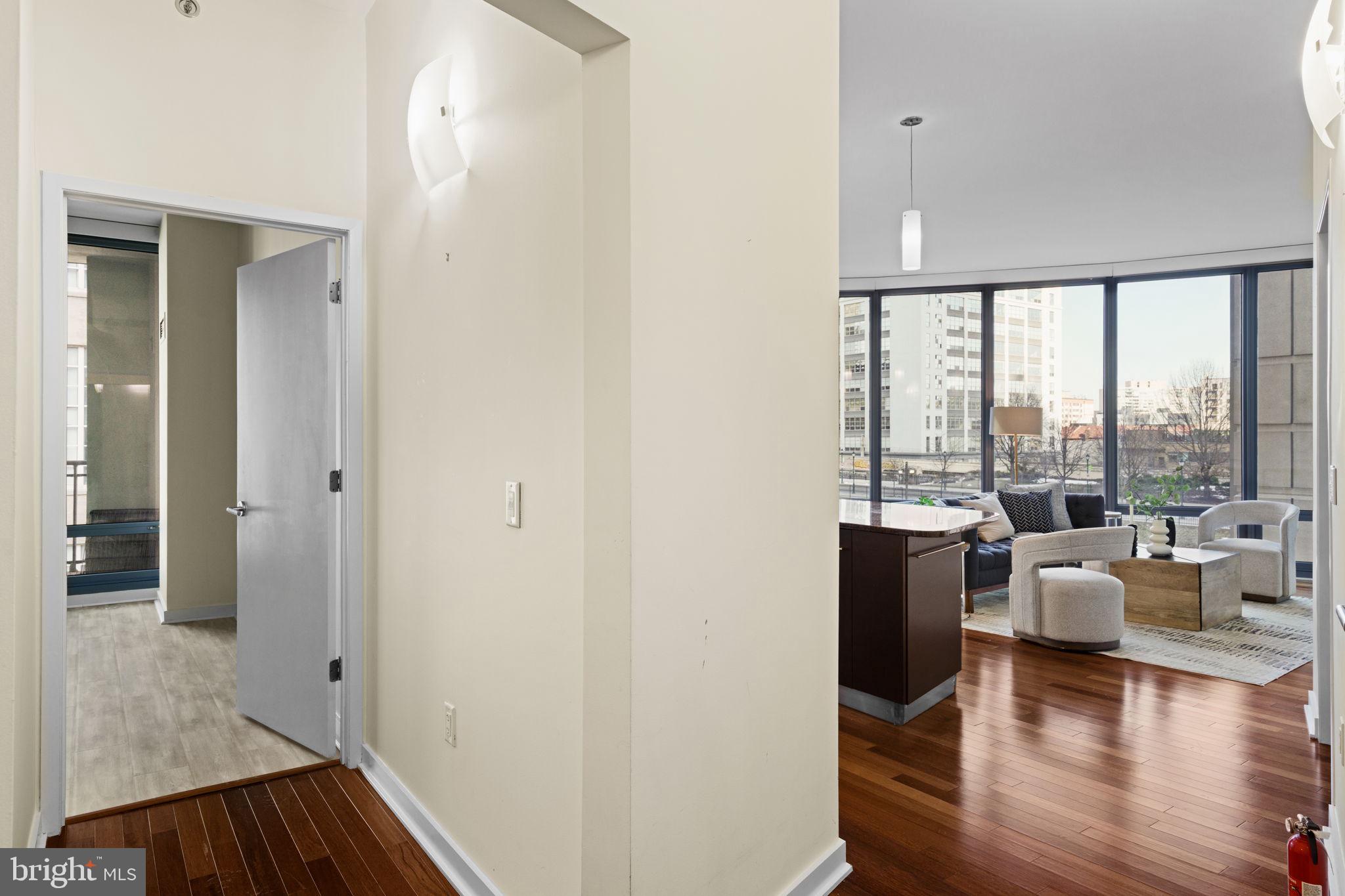 2101 Market Street, Unit 302 Philadelphia, PA 19103 - Photo 8 of 53 wooden floor in an empty room with a window