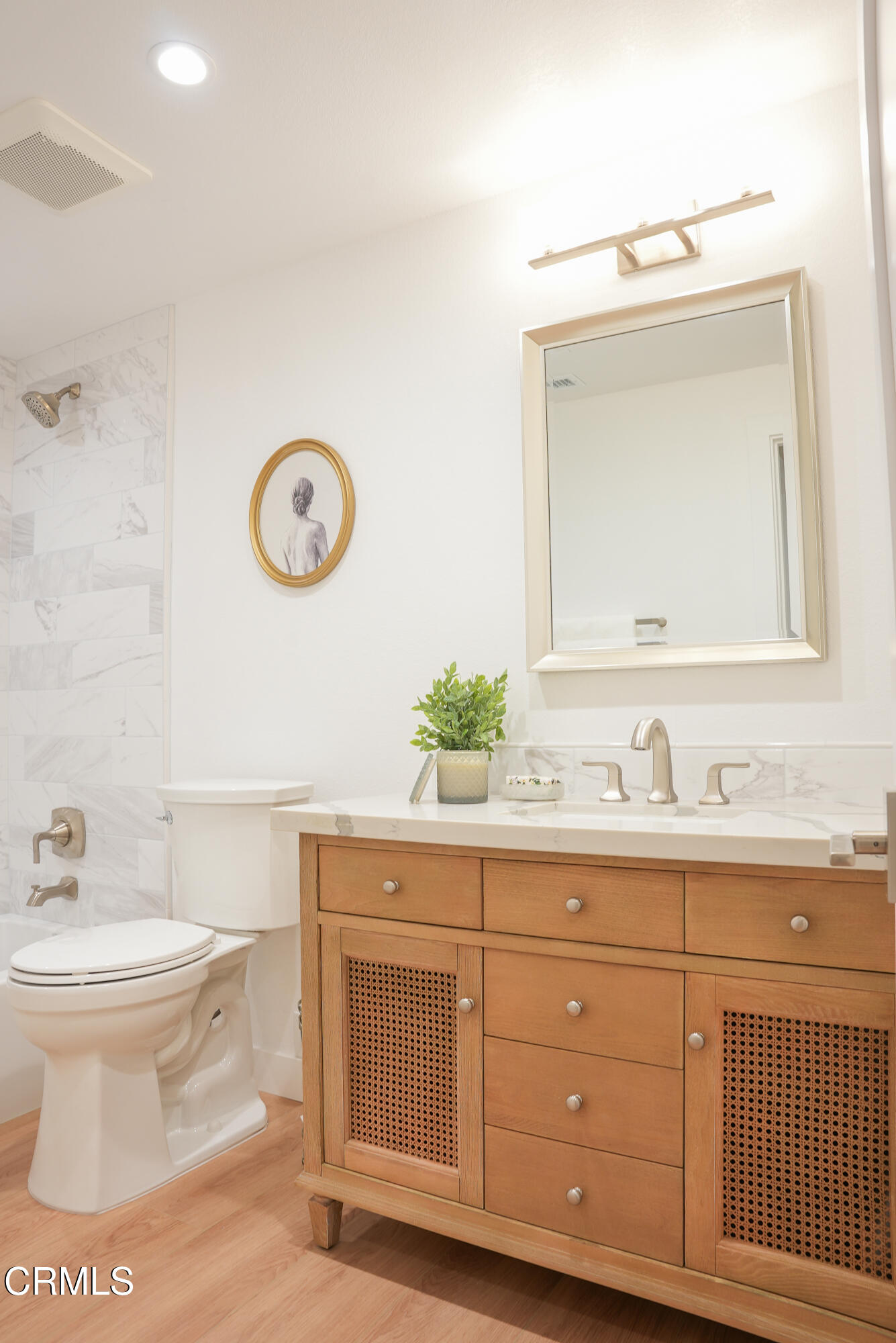 2517 Panama Drive Oxnard, CA 93035 - Photo 16 of 27 a bathroom with a toilet a sink and a mirror