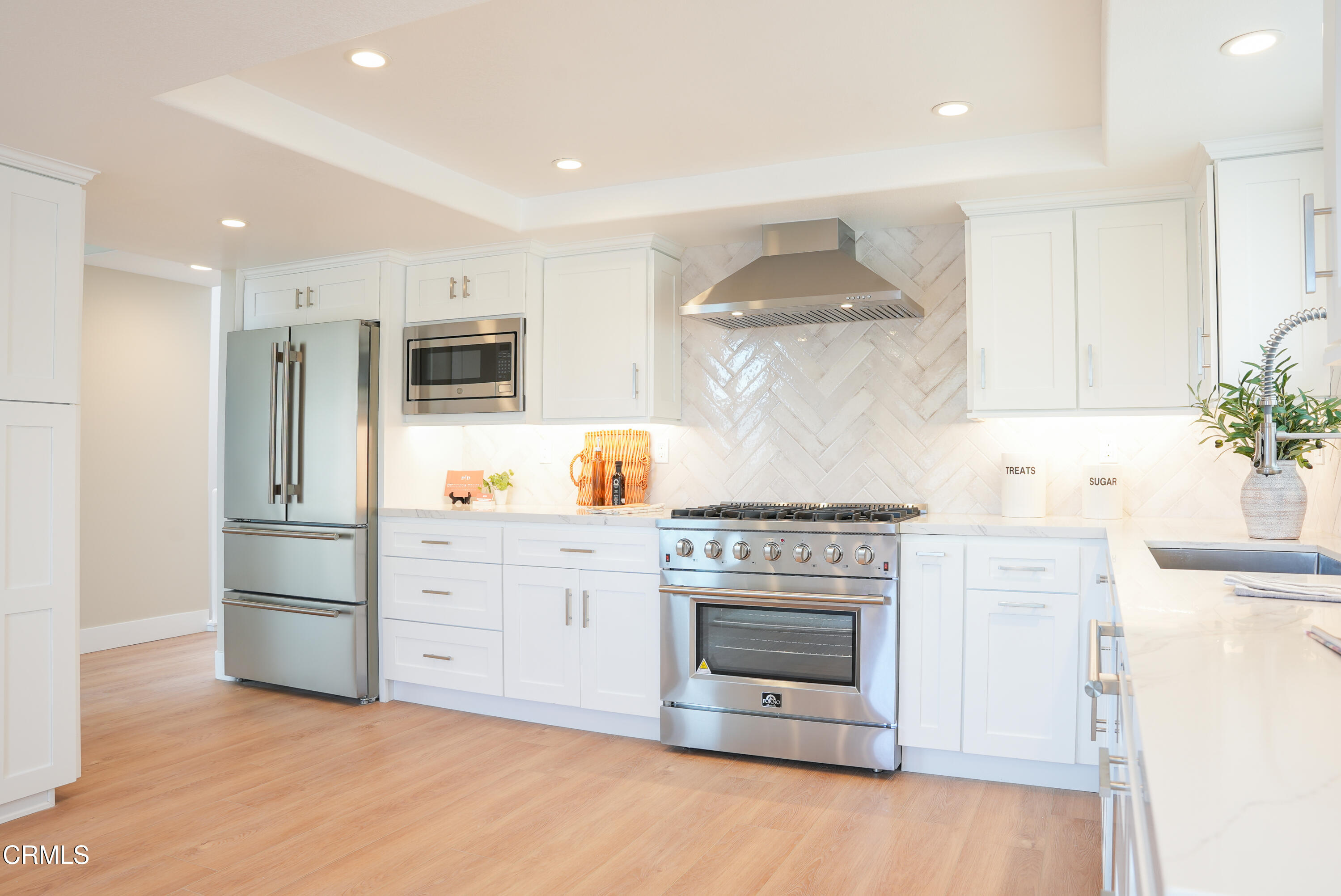 2517 Panama Drive Oxnard, CA 93035 - Photo 4 of 27 a kitchen with stainless steel appliances a stove sink and refrigerator