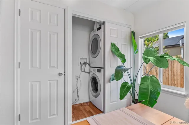 a view of a bedroom with washer and dryer