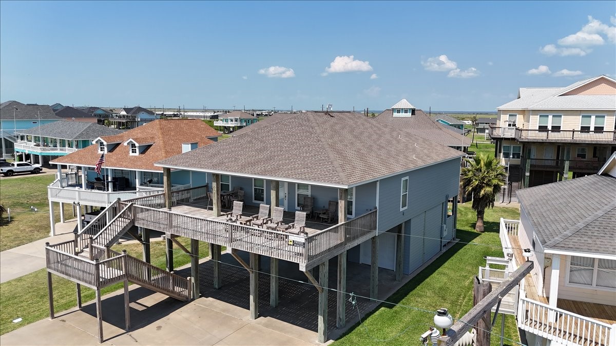 3093 Greg Street Crystal Beach, TX 77650 - Photo 1 of 48 an aerial view of a house with swimming pool and seating space