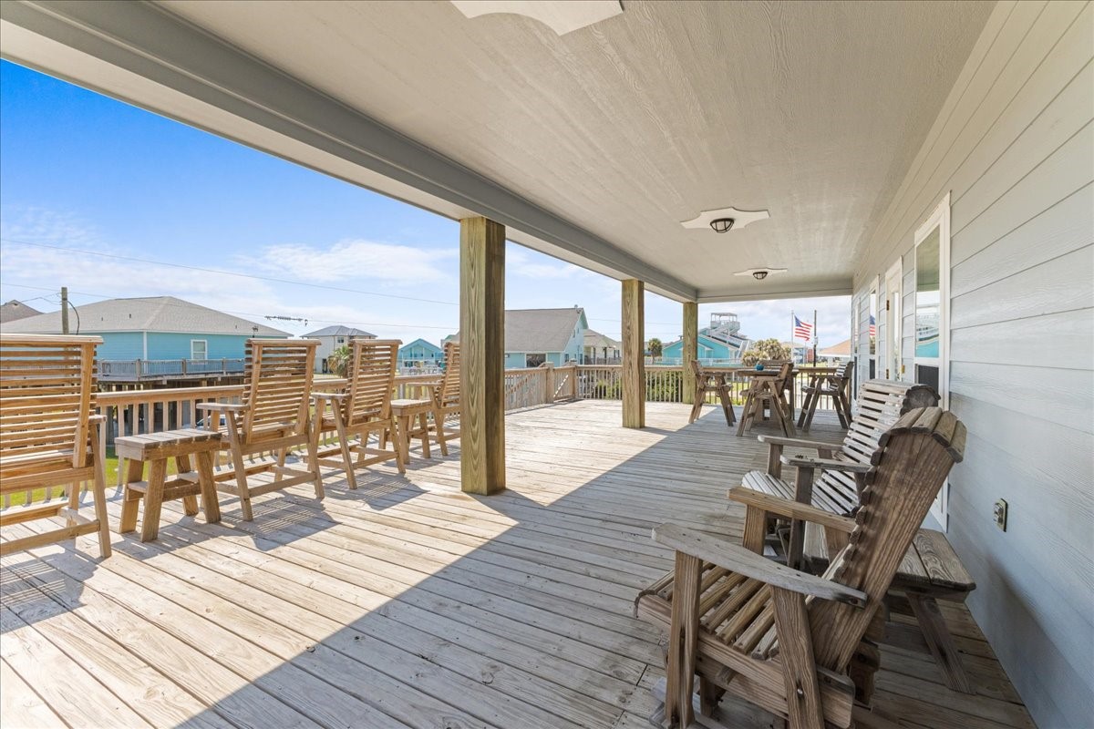3093 Greg Street Crystal Beach, TX 77650 - Photo 11 of 48 a living room with furniture and a floor to ceiling window