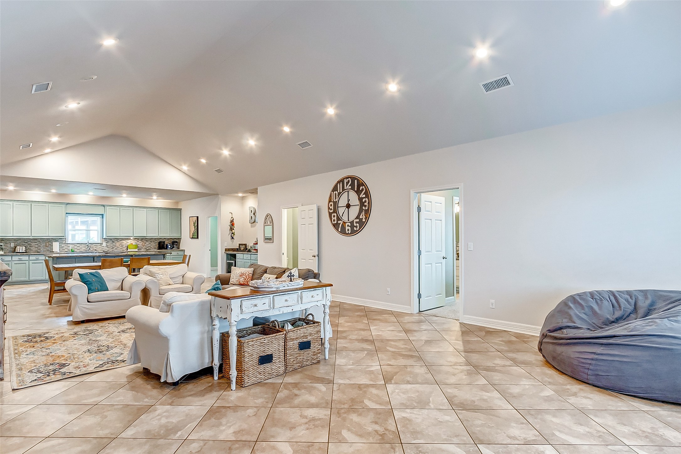 3093 Greg Street Crystal Beach, TX 77650 - Photo 14 of 48 a living room with a couch and a clock