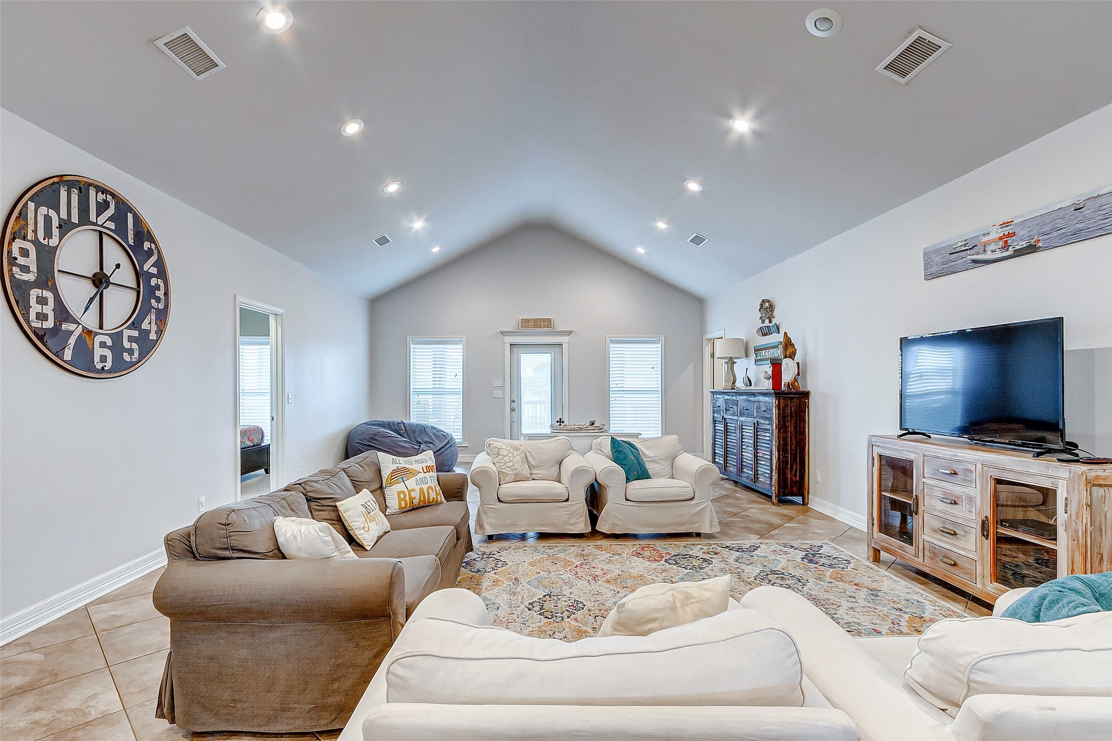 3093 Greg Street Crystal Beach, TX 77650 - Photo 20 of 48 a living room with furniture and a flat screen tv