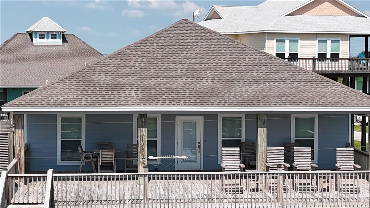 3093 Greg Street Crystal Beach, TX 77650 - Photo 3 of 48 a front view of a house with a large windows