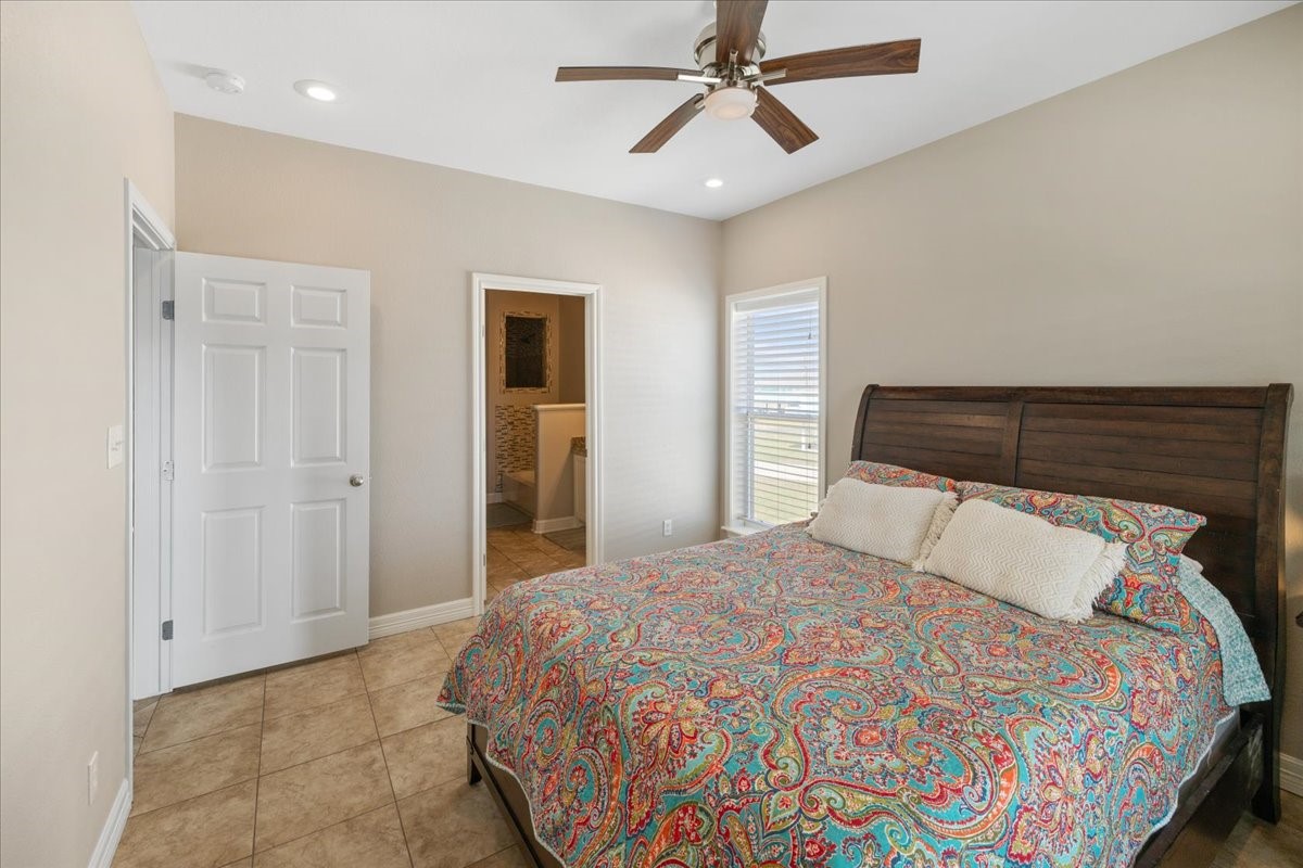 3093 Greg Street Crystal Beach, TX 77650 - Photo 31 of 48 a bedroom with a bed and closet