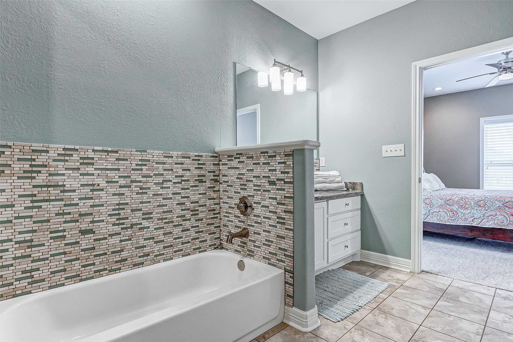 3093 Greg Street Crystal Beach, TX 77650 - Photo 34 of 48 a bathroom with a bathtub and a shower