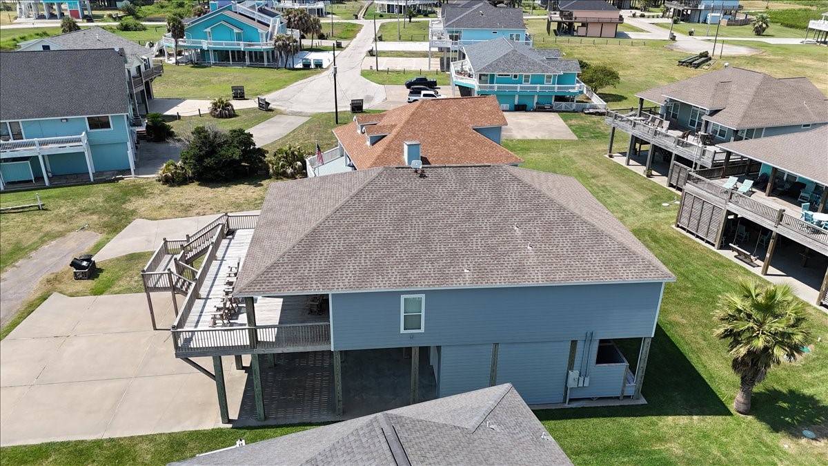 3093 Greg Street Crystal Beach, TX 77650 - Photo 5 of 48 an aerial view of a house with a yard basket ball court and outdoor seating