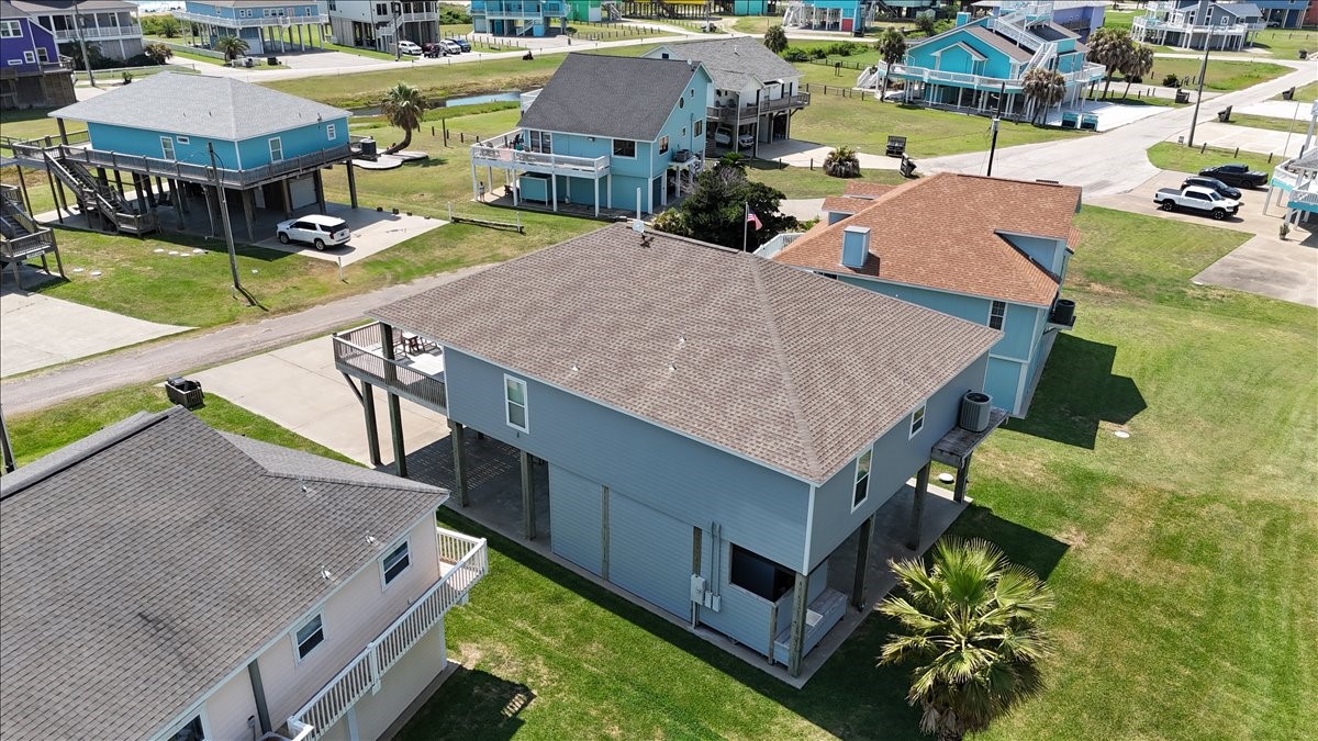 3093 Greg Street Crystal Beach, TX 77650 - Photo 6 of 48 an aerial view of a house with garden space and sitting space