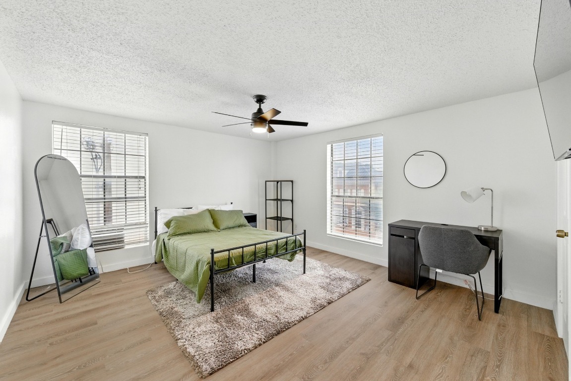 2401 Leon Street, Unit 306 Austin, TX 78705 - Photo 14 of 27 a living room with furniture and a window