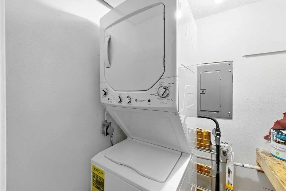 2401 Leon Street, Unit 306 Austin, TX 78705 - Photo 24 of 27 a utility room with dryer and washer