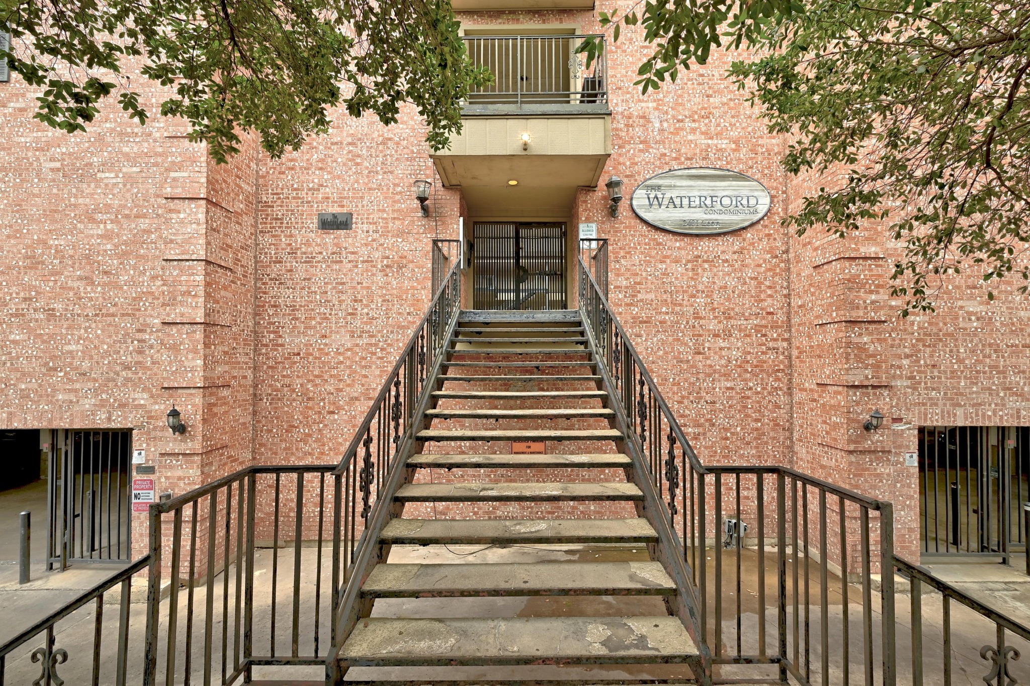 2401 Leon Street, Unit 306 Austin, TX 78705 - Photo 4 of 27 a view of a building with wooden stairs