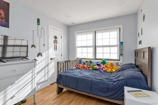 a bathroom with a granite countertop sink and a toilet