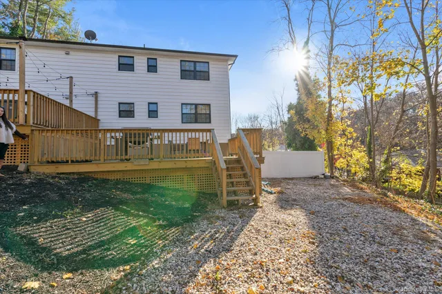 a view of a deck with furniture and wooden floor