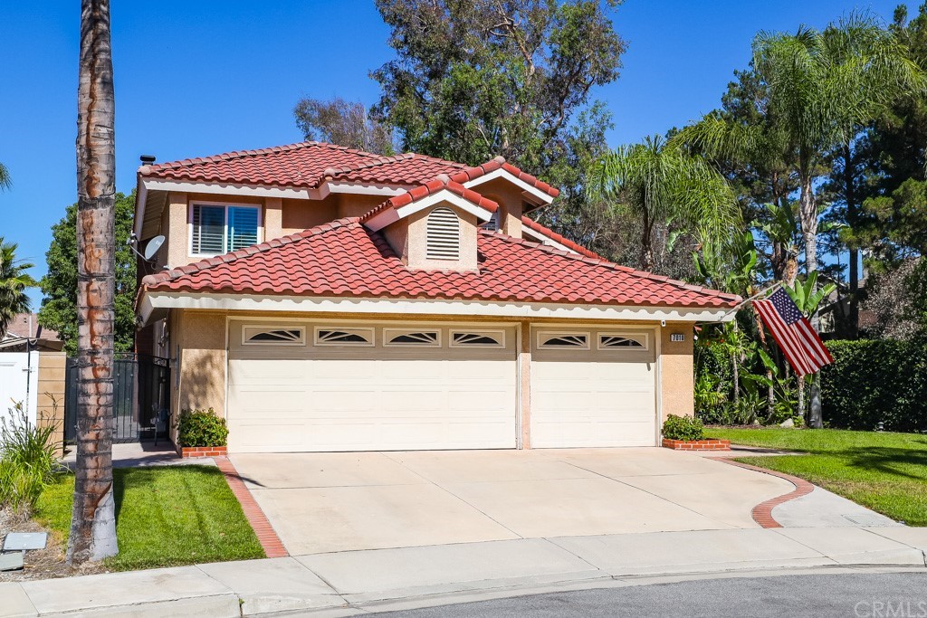7010 Monza Place Rancho Cucamonga, CA 91701 - Photo 1 of 1 a front view of a house with a yard and garage