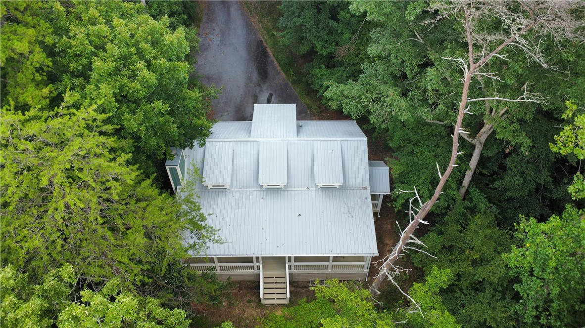 517 Chimney Ridge Westminster, SC 29693 - Photo 3 of 32 Perched amidst verdant foliage, a secluded home offers tranquil living with a spacious front porch.