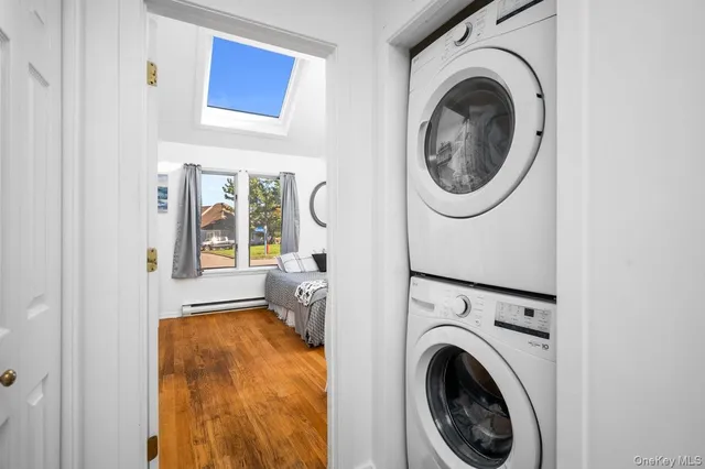 a view of a bedroom with washer and dryer