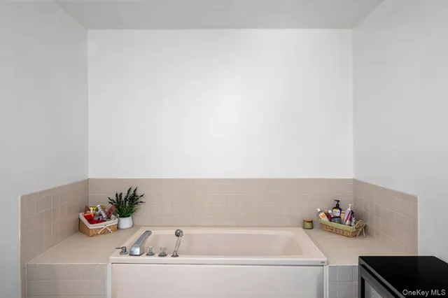 a bathroom with a bathtub and a sink