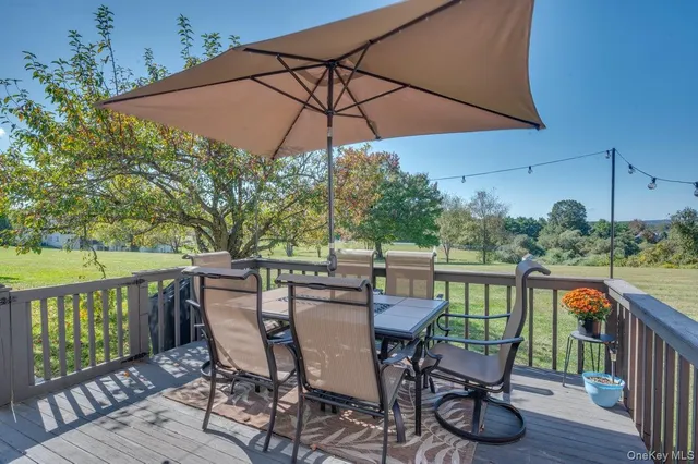 a view of a house with a yard and lake view