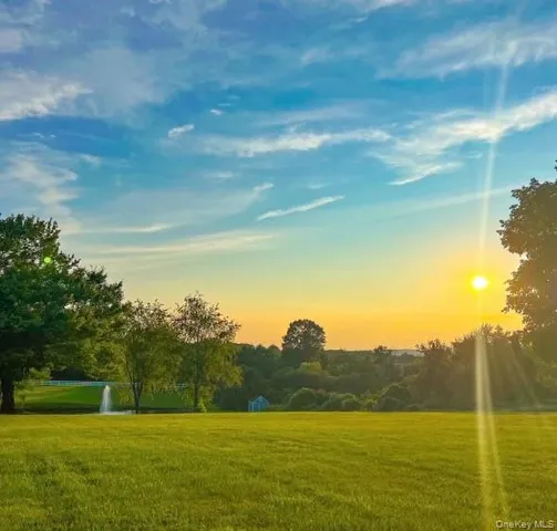 a view of a house with a big yard
