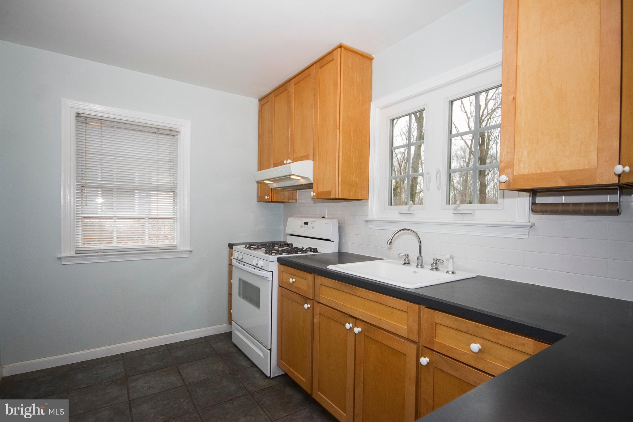 918 Litchfield Road Baltimore, MD 21239 - Photo 10 of 24 Bright & sunny kitchen has replacment windows