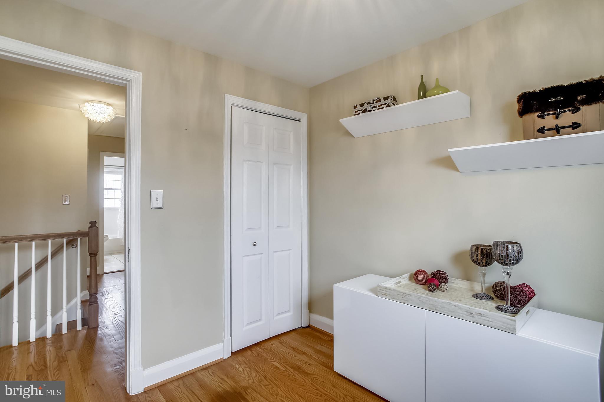 1409 Langford Road Baltimore, MD 21207 - Photo 24 of 39 a room with a window and wooden floor
