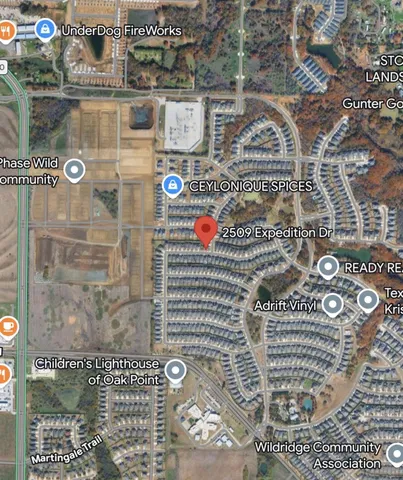 an aerial view of a houses with outdoor space and street view