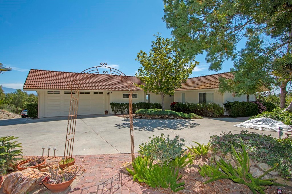 a view of a house with a street