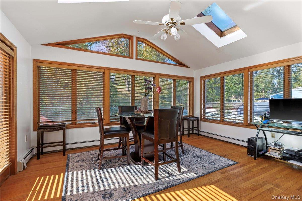 a view of a livingroom with furniture wooden floor and a rug